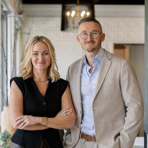 KBF Design Gallery co-owners Ashley Sheaffer and Adam Vellequette standing together in the firm's Maitland showroom