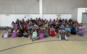 Students attend ArrowHeart Foundation's Backpack and School Supply Drive and select their backpack filled with school supplies at Needles Recreation Center.