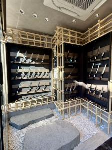 Japanese kitchen knives displayed in the shadow area of MUSASHI JAPAN Omotesando Station Front Store