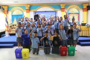 Group photo of Hyatt Regency Phuket Resort's Marine Biological Center team with students from Cherngtalay Municipal School.