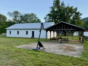 3,548 +/- sf. multi-purpose building/event space on .998 +/- acre in Madison County, VA •	Large cinder block addition w/elevated slab •	Building features:  large gathering hall, warming kitchen, all kitchen appliances convey, all pews convey