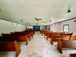 3,548 +/- sf. multi-purpose building/event space on .998 +/- acre in Madison County, VA •	Large cinder block addition w/elevated slab •	Building features:  large gathering hall, warming kitchen, all kitchen appliances convey, all pews convey