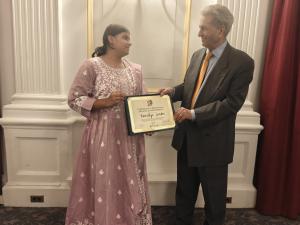 Aaradhya Sunder receives the Certificate of Exceptional Artistic Accomplishment from ICAF founder and chairman Dr. Ashfaq M. Ishaq, July 28, 2026