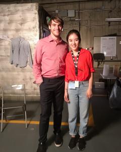 Jieying “Jenny” Liu standing with actor RJ Mitte at Universal Studios during a film production.