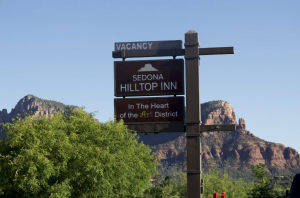 Few places in the world are as closely associated with breathtaking sunsets as Sedona, Arizona The Sedona Hilltop Inn sign