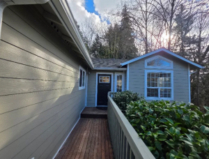 Completed exterior siding and wooden entryway ramp on a residential home by Final Touch Construction LLC.