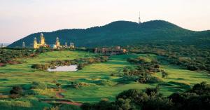 Golf course at Sun City with the Palace of the Lost City rising behind the fairway