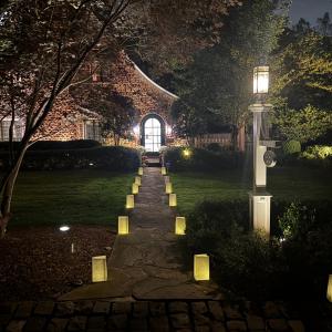 Luminary bags lining a house's entryway