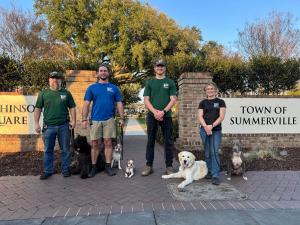 Best Dog Trainer 2026 Canine Revolution team and client dogs at Summerville, SC town entrance