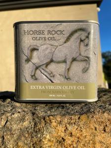 A can of olive oil with the name Horse Rock Olive Oil