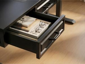 OffiGo standing desk drawer with office supplies and accessories stored inside for an organized home office workspace.