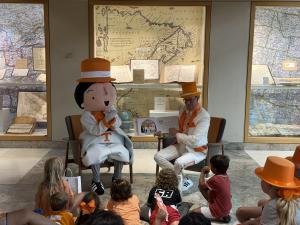 JR Greene and Tuxie Read “My Magic Tux” to Children (Photo courtesy of J.R. Greene)