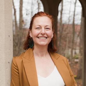 Photo of a woman, professor, with short red hair