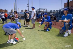 Photo of Tower Buzzers players coaching athletes.