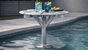 BajaMate, a rapidly growing leader in luxury pool accessories, Baja shelf umbrella systems, in-pool umbrella sleeves, and resort-style outdoor living products, is proud to announce the launch of its all-new and the industry's most comprehensive website, BajaMate BajaMate luxury in-pool table system on a Baja shelf with drinks, designed for resort-style pool living and swim-up entertaining
