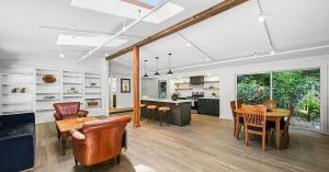 Open living, dining, and kitchen area inside a remodeled Redemption Canyon residence.