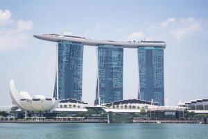 Daytime view of the Marina Bay Sands complex and ArtScience Museum across the water in Singapore.