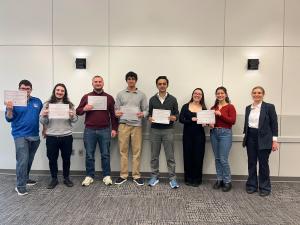 Tahir Jamil and his undergraduate colleagues accepting an award for their mathematical findings