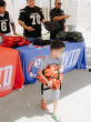 Aptia Continues Aptia Serves Initiative with Back-to-School Bookbag Drive Alongside Star Football Players