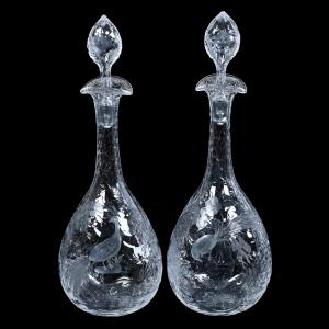 Lot #18 consists of two Brilliant Period Cut Glass (BPCG) rock crystal decanters, each one 14¾ inches tall and featuring a finely engraved tropical bird and floral design. Estimate: $750-$1,500