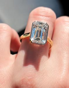 Emerald cut diamond bezel engagement ring in yellow gold by Shapiro Diamonds in Dallas, Texas.