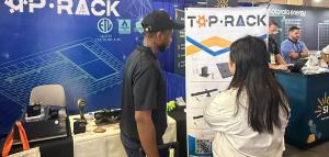 Top Rack Technology team members meet with attendees at Booth 609 during RE+ Mid-Atlantic 2026 in Philadelphia