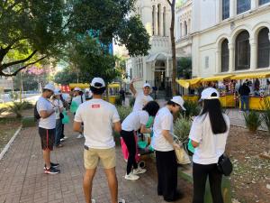 Plushie Planet volunteers preparing supplies in a public square in Brazil