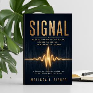 Signal book stands upright on desk with a notebook and pen next to it.