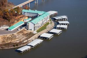 Atlas Docks, LLC is outlining why October through March can be a practical period for Lake of the Ozarks dock owners to document conditions, assess maintenance needs and plan repairs or improvements before the next high-use boating season Aerial view of a waterfront property and covered floating docks at Lake of the Ozarks.
