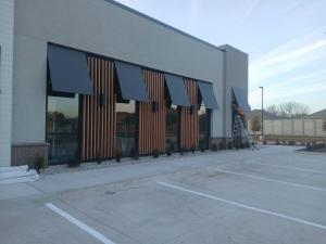 Metal Awnings for Heartland Dental in collaboration with MEC General Contractors