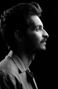 Black-and-white side profile portrait of Middle Eastern and composer Mehran Matin.
