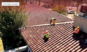 JM Roofing and Construction team members working on a residential tile roof repair project in El Paso, Texas.