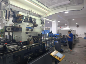 CNC stamping line producing custom metal tins and lids - part of JeysTin's in-house tea and coffee tin production.