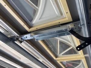Garage door reinforcement strut and opener bracket repair in Las Vegas, NV.