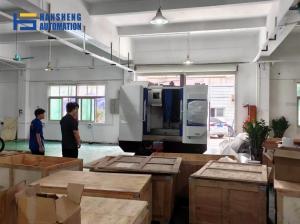 Workers unload new manufacturing equipment at Hansheng Automation's manufacturing facility in Dongguan, China.