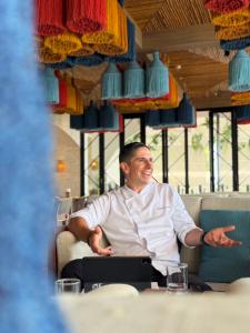 Chef Marcelo Costa seated during an interview at Casa Boho.