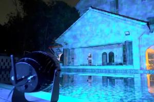 BLHW10 Outdoor Projector Illuminating A Poolside Setting