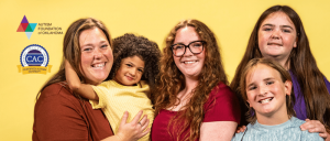 Group portrait of five smiling individuals against a yellow background, featuring logos for Autism Foundation of Oklahoma and Certified Autism Center.