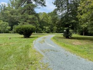 3 BR/1.5 BA Cape Cod-style home w/walk-out basement on 2.15 +/- acres minutes from historic downtown Gordonsville, VA (Louisa County) • The home measures 2,479 +/- gross sf. and features one bedroom and half bath on the main level and 2 bedrooms
