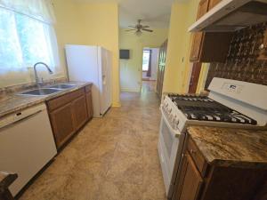 3 BR/1.5 BA Cape Cod-style home w/walk-out basement on 2.15 +/- acres minutes from historic downtown Gordonsville, VA (Louisa County) • The home measures 2,479 +/- gross sf. and features one bedroom and half bath on the main level and 2 bedrooms