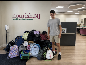 Ethan Resnick delivering backpack donations to Nourish.NJ