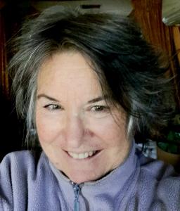 Headshot colour photo of author Maureen B. Roberts