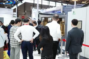 Visitors discussing Huasheng coating equipment at CCMT 2026.