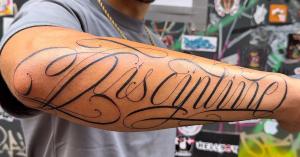 Lettering tattoo Amsterdam. Freehand script lettering on forearm by Rot_Priest at Knight of Swords