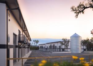 Two micro-bay flex building exteriors with the sunset in the background