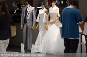 Participants explore wedding attire options.