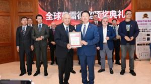 Ambassador Plenipotentiary of Albania to China Riza Poda receiving GFA Award