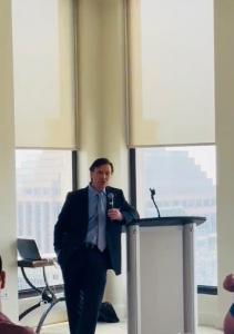 Jose M. Berlanga speaking to an audience at a business event.