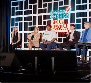 Panel of five dental professionals speaking on stage at the Supercharge Your Dental Practice conference