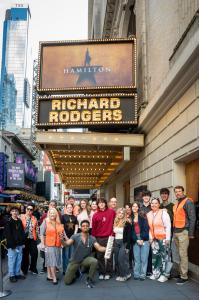 Group of EduHam students posing outside the Richard Rodgers Theatre in New York City.